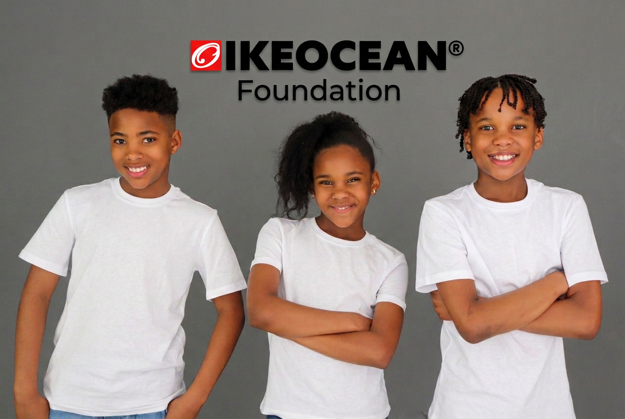 Three children beneath the official Foundation wall sign